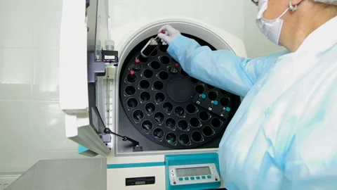 The nurse installs a flask in the device Stock Footage 93022258