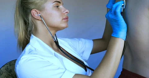 Nurse listens to the lungs of a child using a stethoscope Stock Footage 108822717