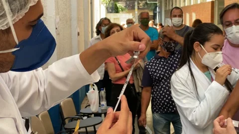 A nurse loads a syringe with the Pfizer BioNTech vaccine in Sao Paulo, Brazil 4K Stock-Footage 153632669