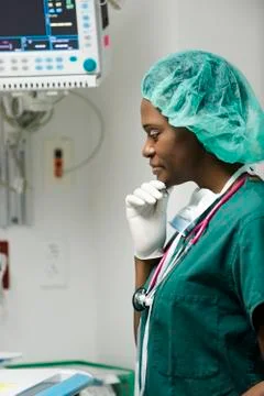 Nurse looking away in thought Fotos Stock