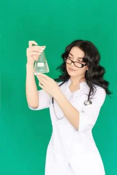Nurse looks at the flask Stock Photos