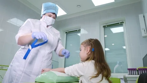 Nurse makes blood sampling from a child Stock Footage 86733837