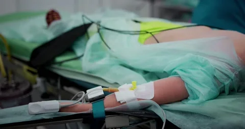 The nurse makes an intravenous infusion. Close-up of a hand with a catheter Stock Footage 163961155