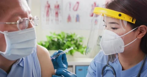 Nurse making a vaccination Stock Footage 147370122