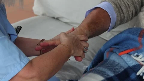Nurse performing hand massage to elderly patient Stock Footage 300172067