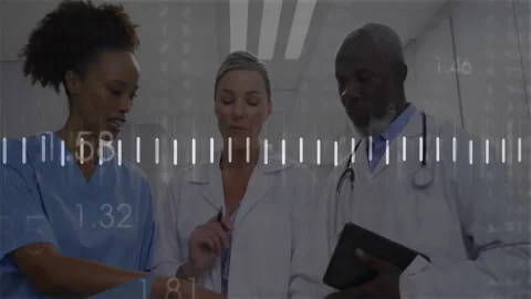 Nurse pointing at chart, initiating waveform while doctors tapping iPad Stock Footage 312715591