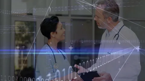 Nurse pointing at tablet starting binary overlay, doctor rotating tablet, Stock Footage 311216443