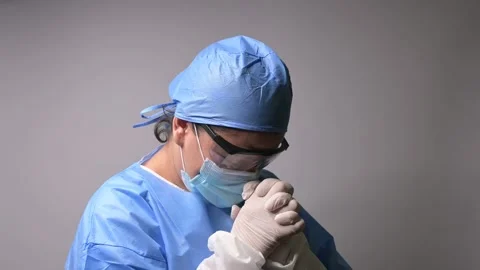 NURSE PRAYING Stock Footage 154179256