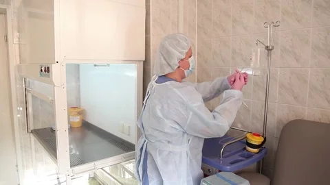 A nurse prepares a solution for chemotherapy Stock Footage 82002009