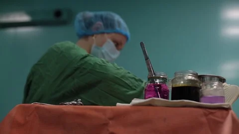 The nurse prepares the tools required for the operation Stock Footage 70808161