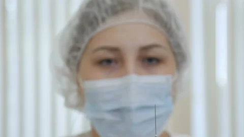 A nurse is preparing to give an injection Video stock 92192944