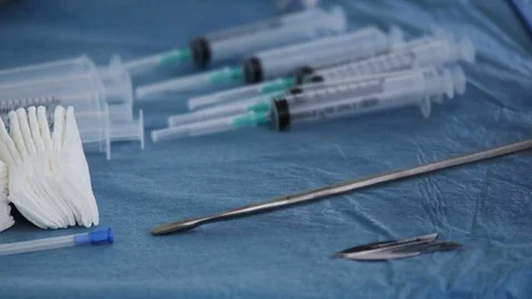 Nurse preparing the instruments before the surgery in the operating room Stock Footage 83583384