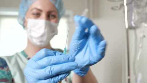Nurse is preparing the needle Stock Footage 91626137