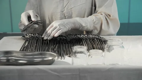 Nurse preparing sterile surgical instruments, healthcare worker prepares tools Video stock 201483609