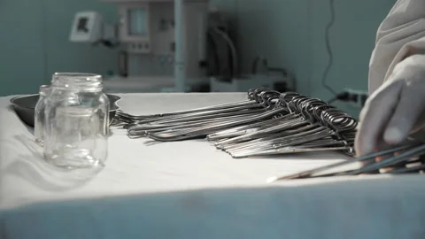 Nurse preparing sterile surgical instruments, healthcare worker prepares tools Video stock 201483676
