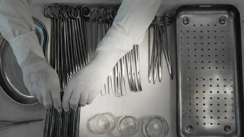 Nurse preparing sterile surgical instruments, healthcare worker prepares tools Video stock 201484541
