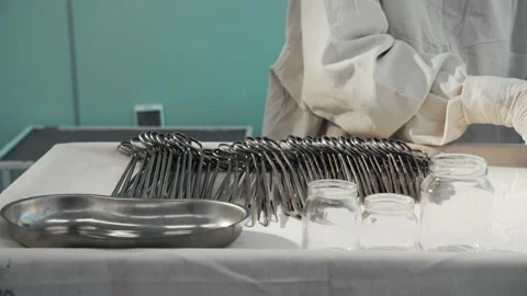 Nurse preparing sterile surgical instruments, healthcare worker prepares tools Video stock 201524244