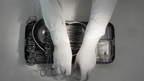 Nurse preparing sterile surgical instruments, healthcare worker prepares tools Stock-Footage 201525010