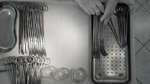 Nurse preparing sterile surgical instruments, healthcare worker prepares tools Video stock 201729481