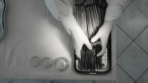 Nurse preparing sterile surgical instruments, healthcare worker prepares tools Video stock 201952171