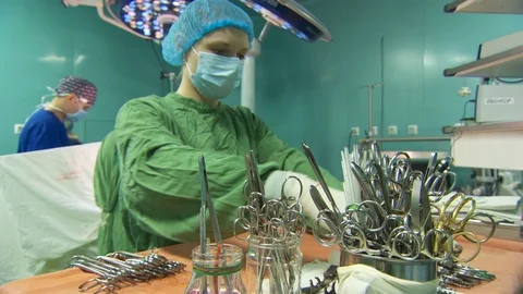 Nurse preparing surgical instruments for heart surgery. operating room. Video stock 95940940