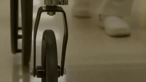 Nurse pushing wheelchair Stock Footage