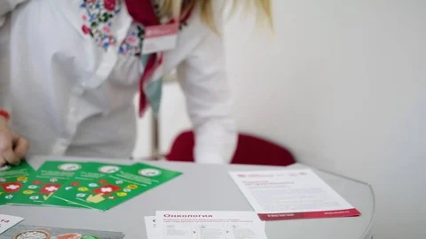 Nurse put a white first-aid kit on the table during an epidemic. Women's hands t Stock Footage 100875112