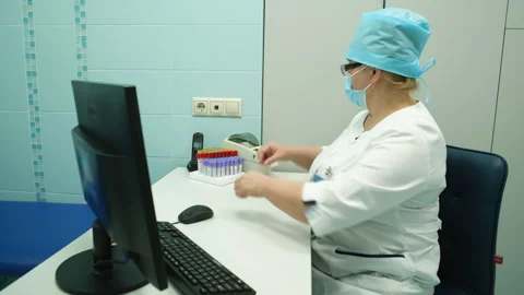A nurse puts a barcode on a blood test tube. Stock Footage 249667150