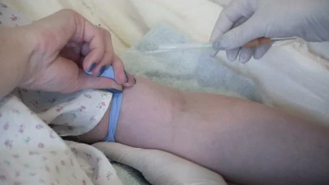 The nurse puts a drip on the patient Video stock 147029196