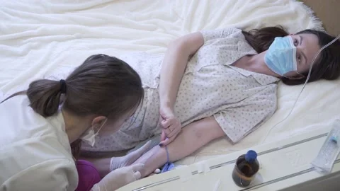 The nurse puts a drip on the patient Video stock 147030491