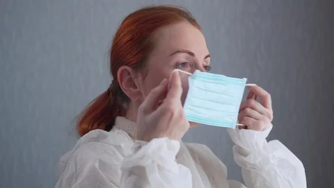 The nurse puts on a protective mask. Stock Footage 128699719