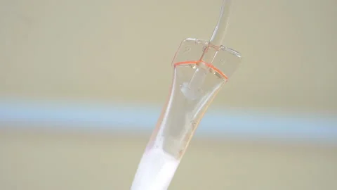 Nurse putting a drip into the catheter lying patients close-up.Injection vaccine Stock Footage 96604443