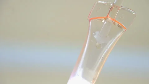 Nurse putting a drip into the catheter lying patients close-up.Injection vaccine Stock Footage 96604727