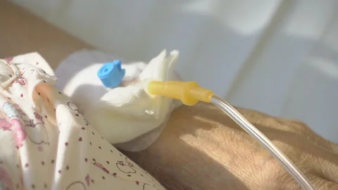 Nurse putting a drip into the catheter lying patients close-up.Injection vaccine Stock Footage 96606500