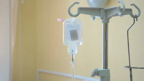 Nurse putting a drip into the catheter lying patients close-up.Injection vaccine Stock Footage 96606652