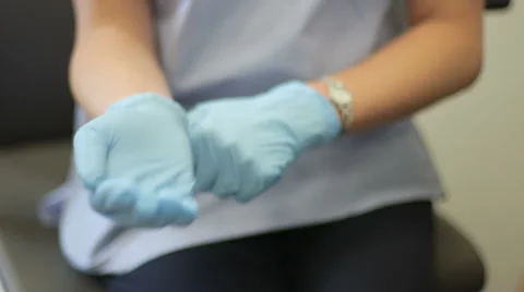 Nurse Putting on Gloves Stock Footage 55828777
