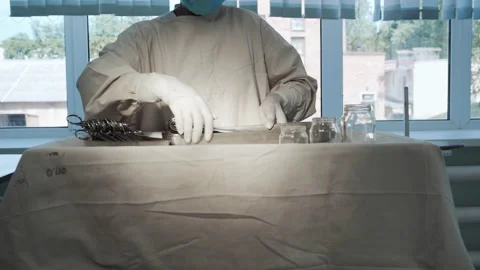 Nurse putting surgical instruments on table, preparing tools for operation Video stock 201523671