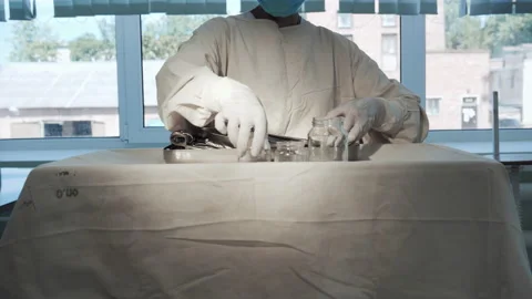 Nurse putting surgical instruments on table, preparing tools for operation Video stock 201729596
