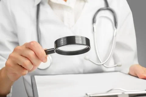 Nurse reading analyzes Stock Photos