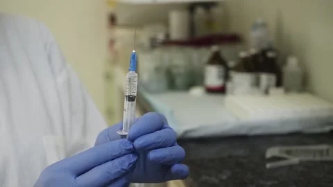 The nurse is ready to give the injection. Stock Footage 159882469