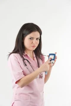 Nurse ready with stethoscope and glucometer Stock Photos