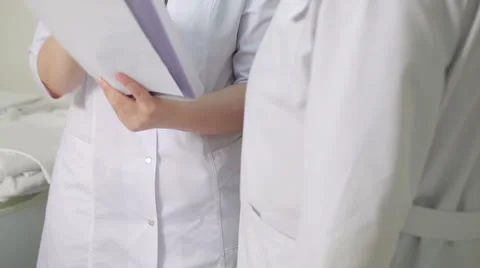 The nurse reported to the doctor about medical tests. Stock Footage