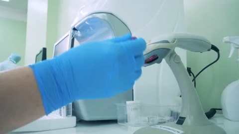A nurse scanning empty tubes, close up. Video stock 91141908