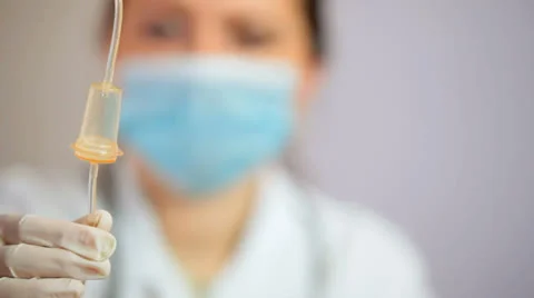 Nurse setting up IV Drip Stock Footage 22902410