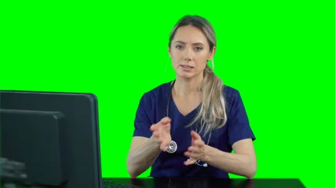 Nurse sitting in front of computer talking to patient. Telemedicine video chat Stock Footage 132007689