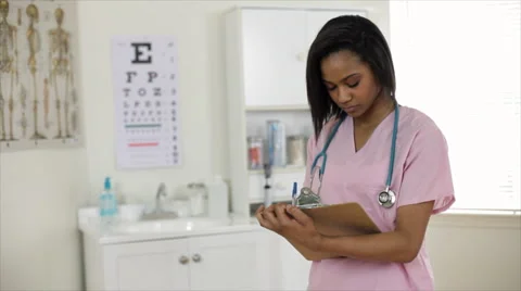 Nurse smiles at camera Stock Footage