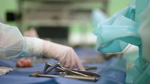 Nurse is sterilising tools in surgery during operating, closeup of table with Stock-Footage 167111902