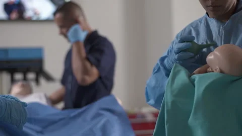Nurse Student Practicing with Training Mannequin Stock Footage 233764704