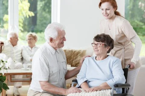 Nurse supports disabled senior woman Stock Photos