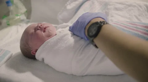 New born baby boy swaddled immediately a, Stock Video